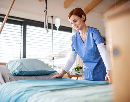 nurse-changing-sheets-in-hospital